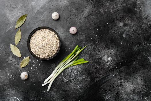 Pearl Barley Heap set, on black dark stone table background, top view flat lay, with copy space for text