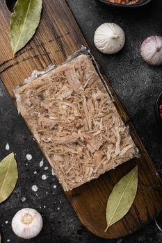 Homemade jelly meat with mustard and horseradish set, on black dark stone table background, top view flat lay