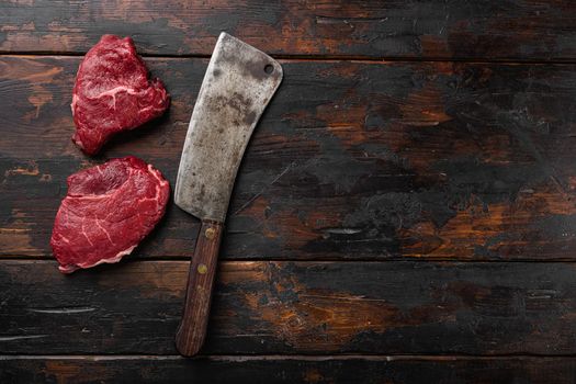 Beef raw rump steak with salt pepper rosemary set, on old dark wooden table background, top view flat lay, with copy space for text