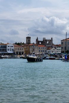 view on the harbour of Saint-Martin-de-Ré from boat when entering the harbour from the sea on summerday