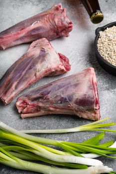 Fresh lamb shank set, on gray stone table background