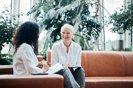 two business women discussing the terms of a new contract. business concept .