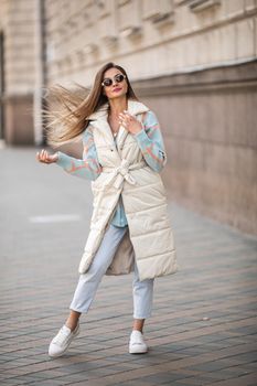 picture of an attractive caucasian female model wearing fashionable clothes