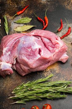 Fresh pieces pork ready to cook set, on old dark rustic table background