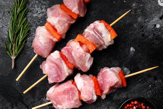 Raw shish kebab. Barbecue Meat Spices and Herbs set, top view flat lay, on black dark stone table background