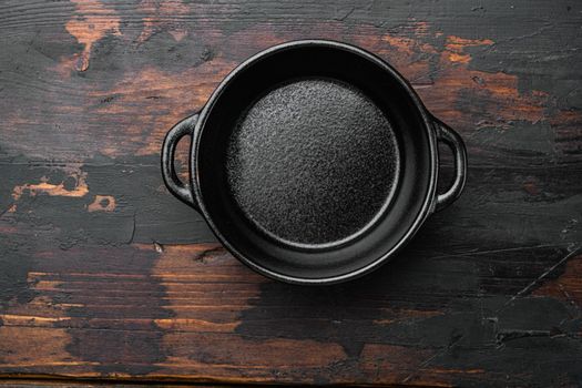 Empty cooking pot set with copy space for text or food with copy space for text or food, top view flat lay, on old dark wooden table background