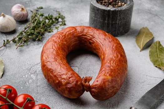 Pork dry cured meat sausage set, on gray stone table background