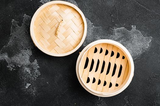 Empty Bamboo Steamer set, with copy space for text or food, with copy space for text or food, top view flat lay, on black dark stone table background