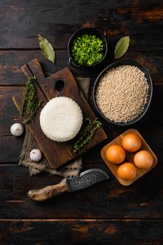 Rice with tofu ingredients set, on old dark wooden table background, top view flat lay