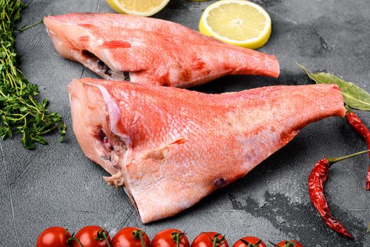 Whole raw red snapper fish set, on gray stone table background