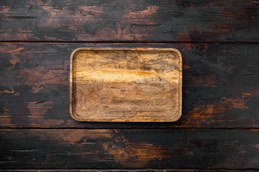 Rustic cutting board for food set, top view flat lay , with copy space for text or your product, on old dark wooden table background