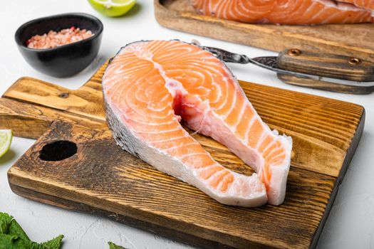 Salmon raw steak set, on white stone table background