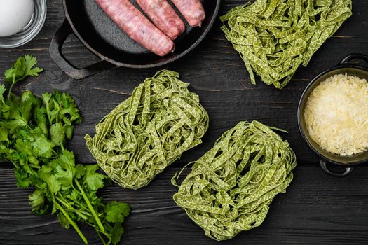 Easy sausage carbonara ingredients set, on black wooden table background, top view flat lay