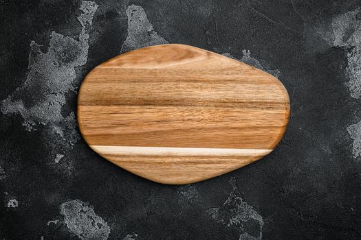 Empty cutting board set, on black dark stone table background, top view flat lay , with copy space for text or your product