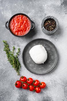 Buffalo mozzarella set, on gray stone table background, top view flat lay