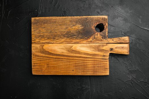 Rustic cutting board set, top view flat lay , with copy space for text or food, on black background