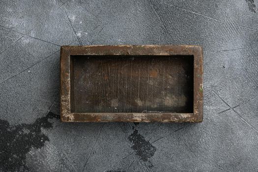 Empty wooden box set with copy space for text or food, top view flat lay, on gray stone table background