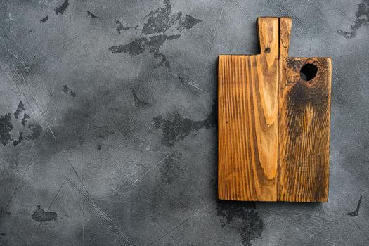 Scratched chopping board set, top view flat lay , with copy space for text or food, on gray stone table background