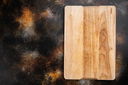 Pine wooden cutting board set, on old dark rustic table background, top view flat lay , with copy space for text or your product