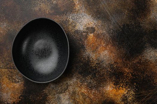 black pottery bowl set, with copy space for text or food, with copy space for text or food, top view flat lay, on old dark rustic table background