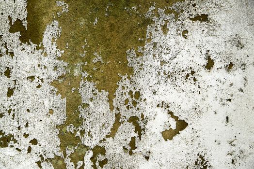 Heavily weathered plastered wall with paint wearing away