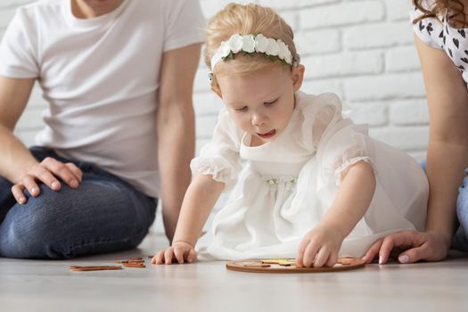 Mother holds her child with hearing aids and cochlear implants . Deaf and health