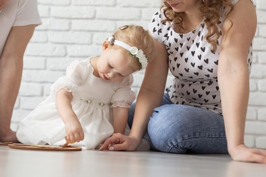 Mother holds her child with hearing aids and cochlear implants . Deaf and health