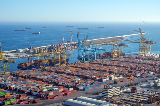 BARCELONA, SPAIN - February 02, 2022: The commercial harbour of Barcelona with containers and cranes