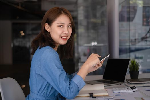 A businesswoman completes KYC using an online banking program in order to open a digital savings account. The definition of cyber security