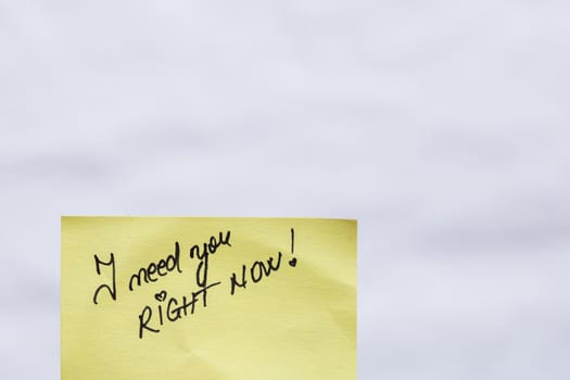 I need you right now handwriting text close up isolated on yellow paper with copy space.