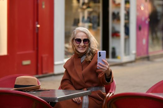 Blonde woman talking on video call