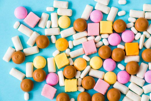 Sweet colorful confectionery, candy on the color background, high angle view