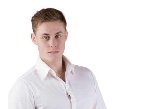 Portrait of a young man in a white shirt on an isolated background.