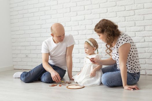 Mother holds her child with hearing aids and cochlear implants . Deaf and health