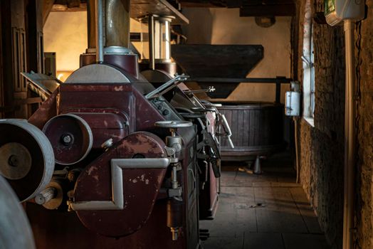 Interior shot of an old historic factory with machinery