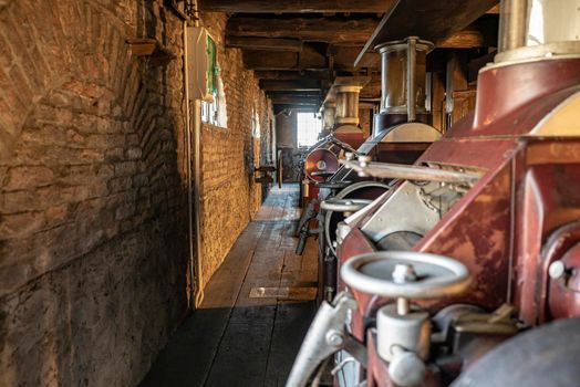 Interior shot of an old historic factory with machinery