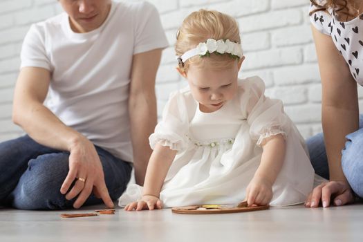 Mother holds her child with hearing aids and cochlear implants . Deaf and health