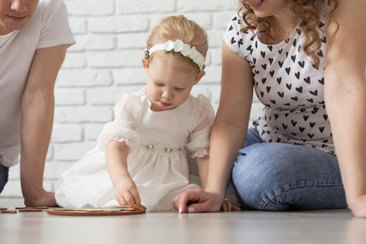 Mother holds her child with hearing aids and cochlear implants . Deaf and health