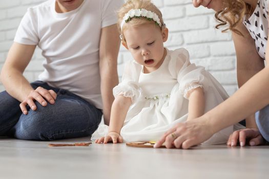 Mother holds her child with hearing aids and cochlear implants . Deaf and health