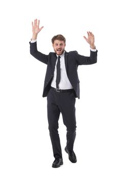 Cheering successful business man with arms raised full length studio portrait isolated on white background