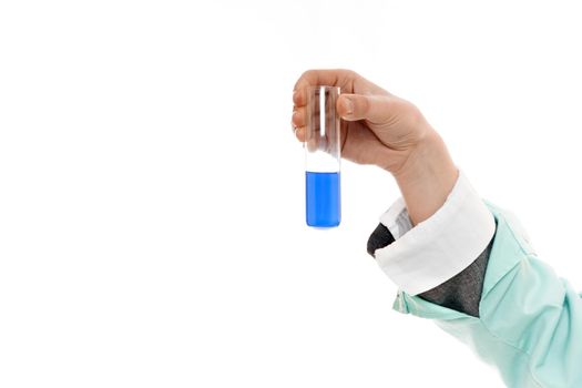 Female doctor holding test tube with blue liquid on white background.