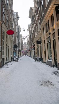Snowy Red LIght District in winter in Amsterdam the Netherlands