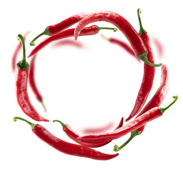 Red hot pepper levitates on a white background.