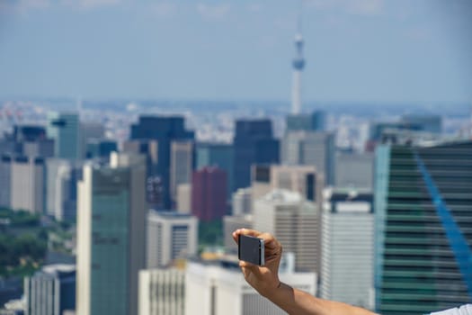 Tokyo Sky Tree and Smartphone. Shooting Location: Tokyo metropolitan area