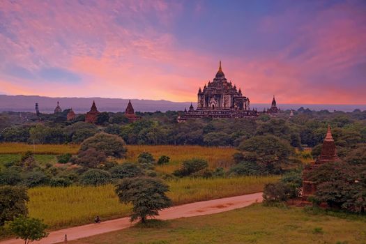 Ancient pagodas in the landscape from Bagan in Myanmar at sunset