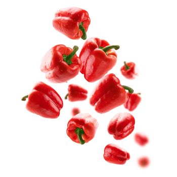 Red paprika levitates on a white background.