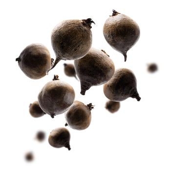 Ripe beets levitate on a white background.