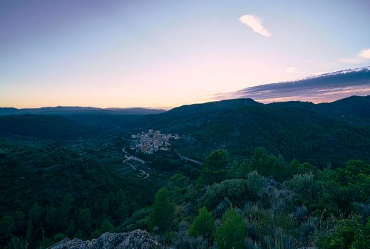 Mountain village landscape from above. Vall de Almonacid. Summer sunset, panoramic view,