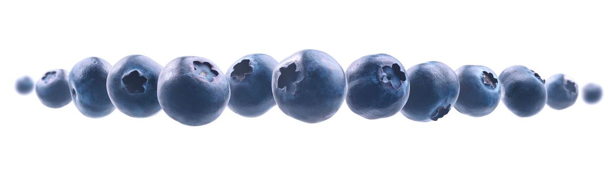 Ripe blueberries levitate on a white background.