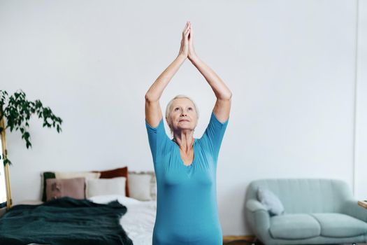 Elderly female doing rehab exercises. Sports and a healthy lifestyle in retirement.